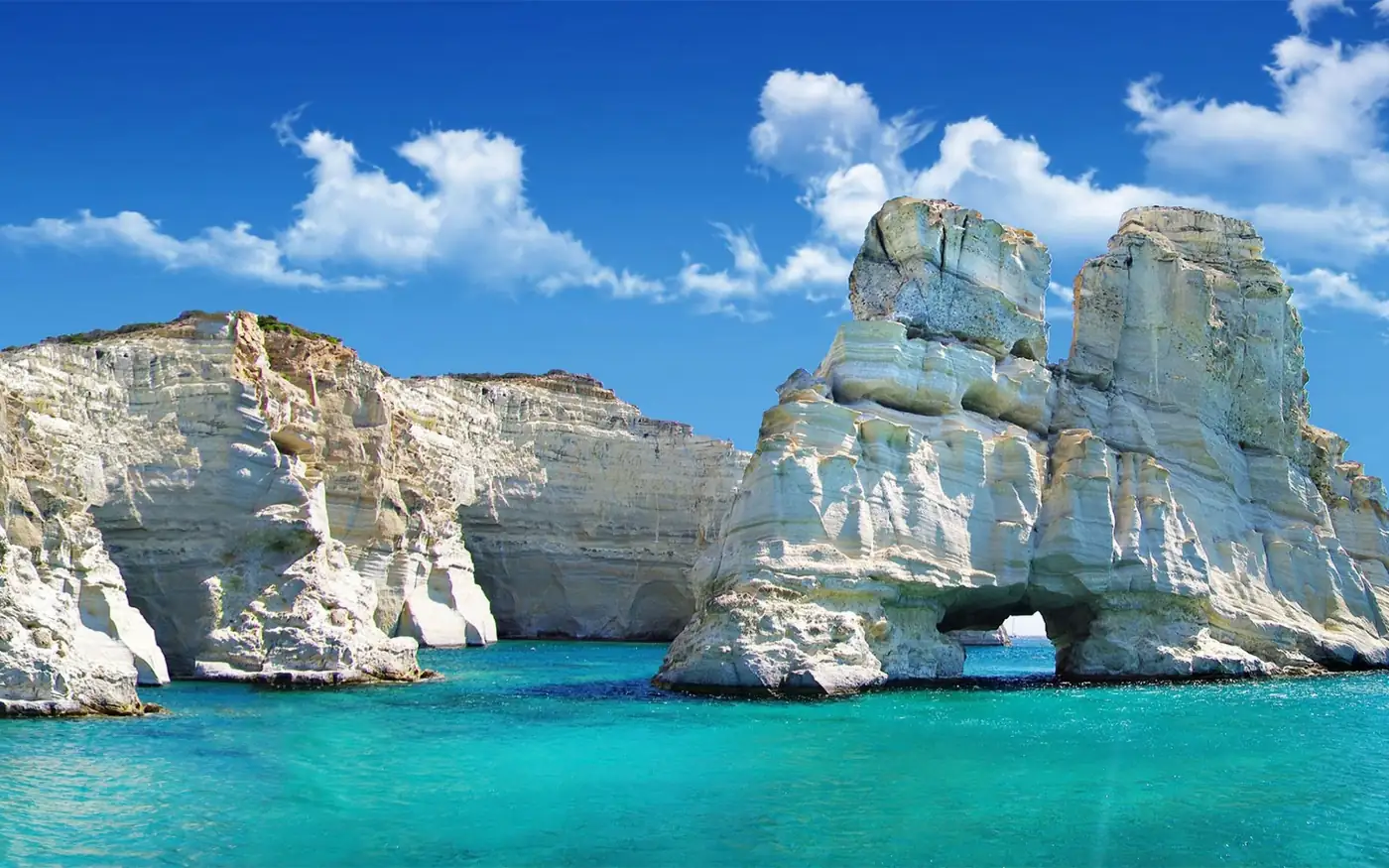 The white rock arches of Kleftiko rising from turquoise water