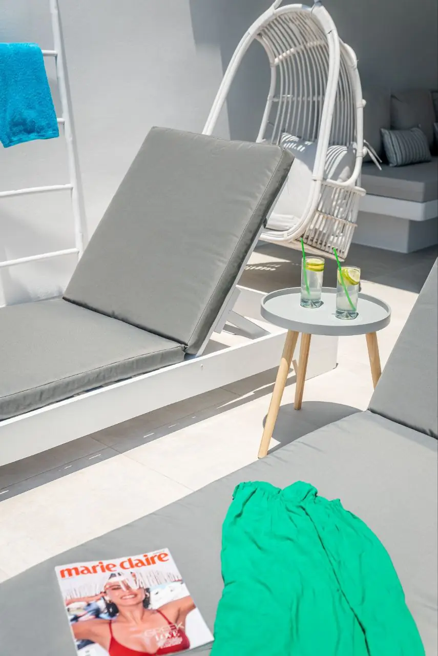 Sun loungers with drinks and a magazine