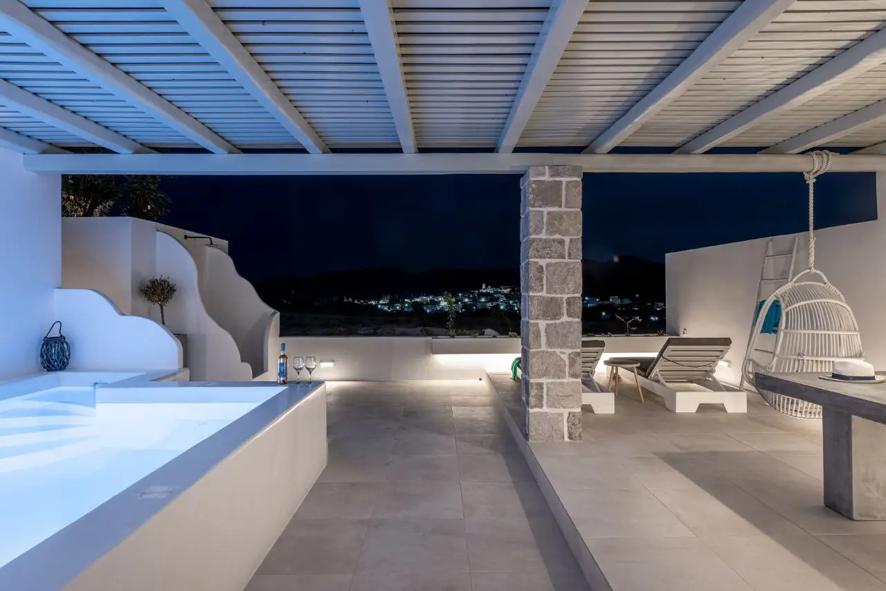The terrace at night with the lights of Adamas